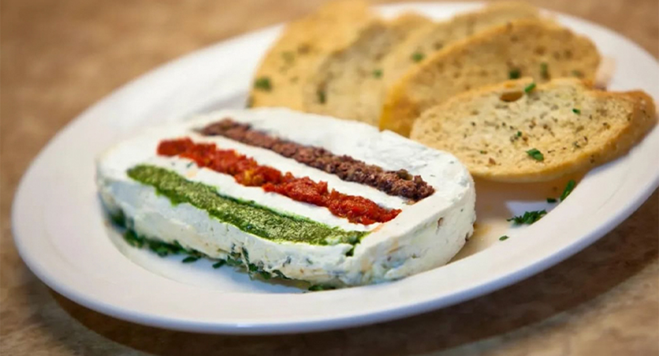 goat cheese and bread on a plate